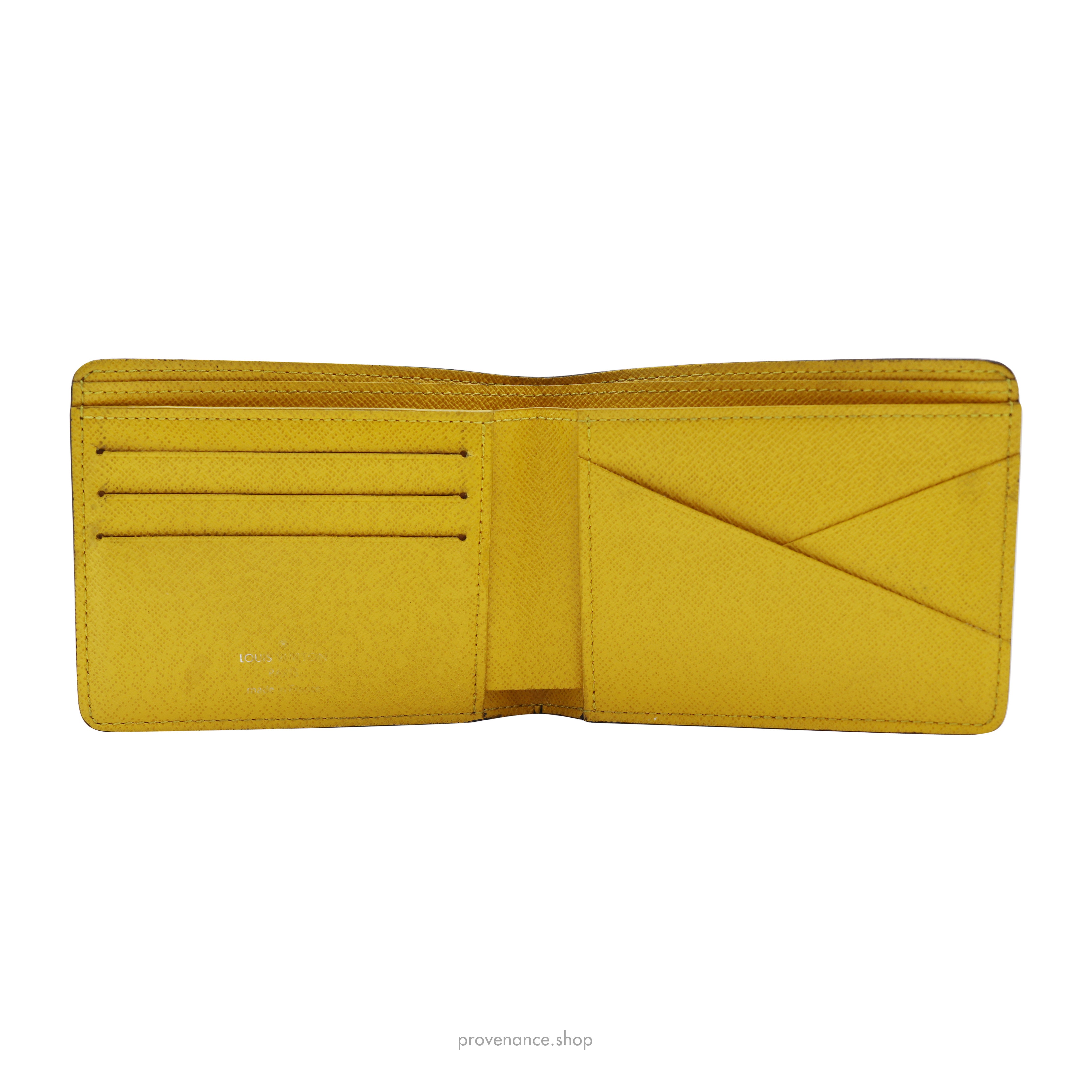 Louis Vuitton Men's Taiga Leather Multiple Wallet