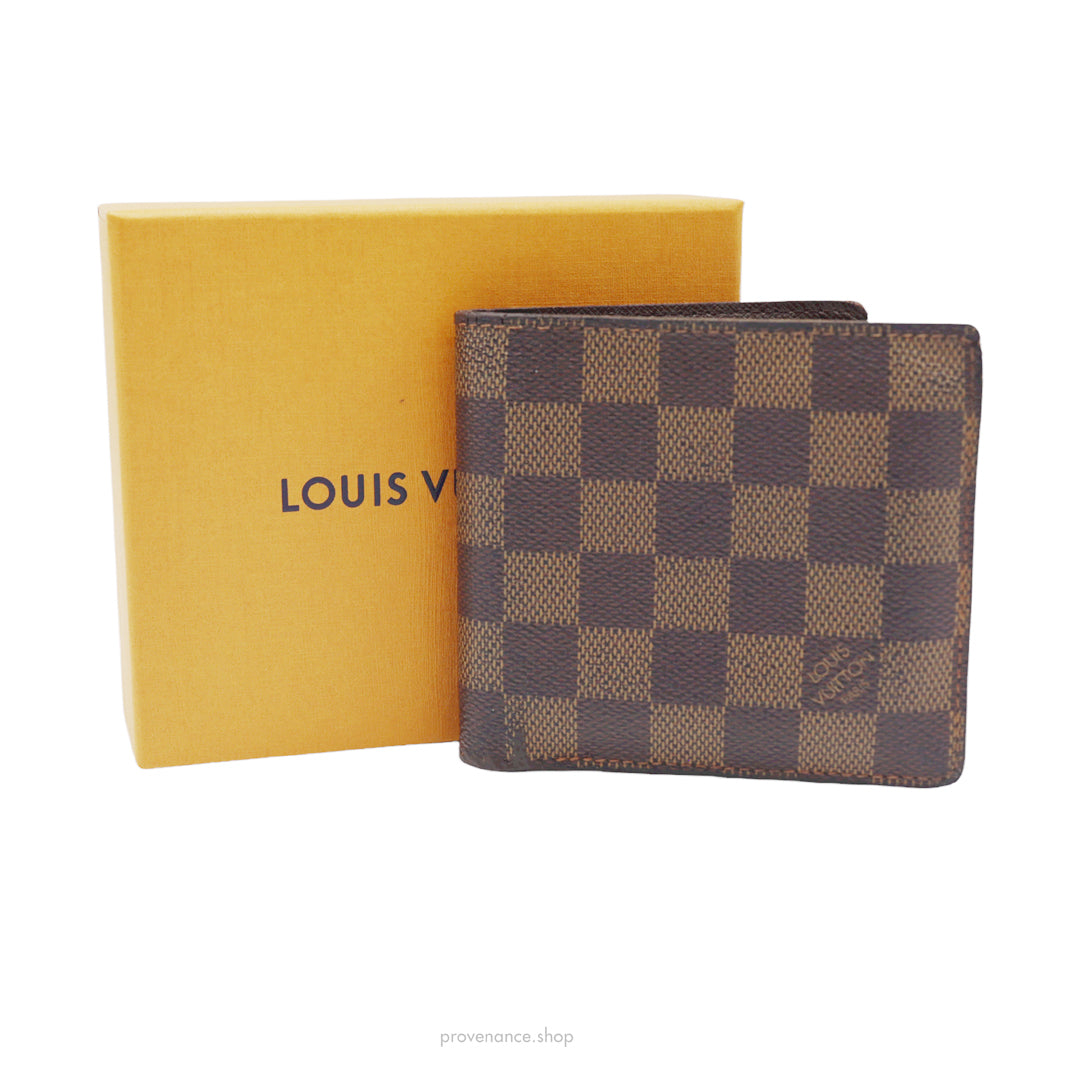 Louis Vuitton card holder in damier monogram.